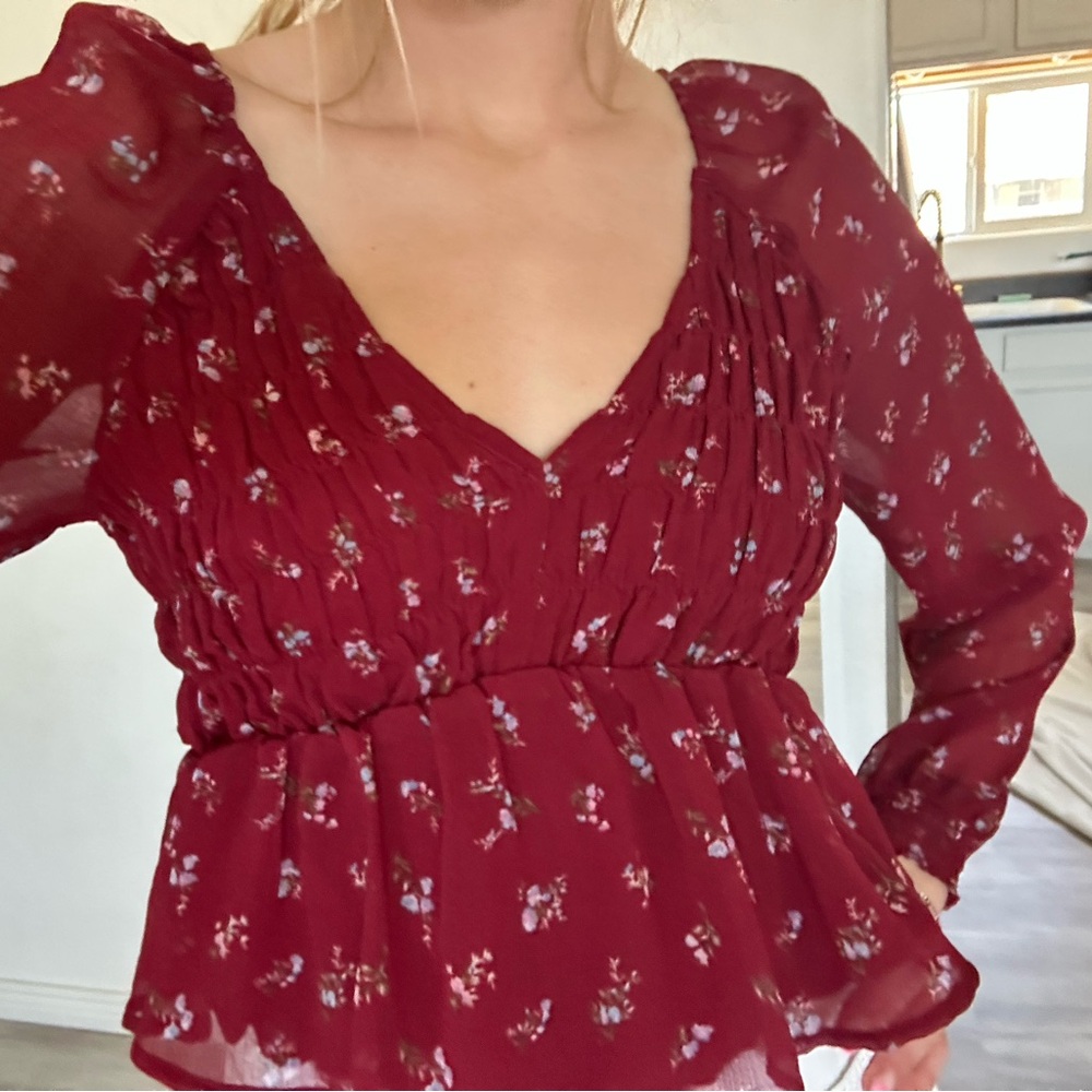 Long sleeve red top. Mesh sleeves